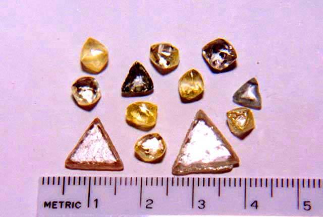 Rough fancy color diamonds: dodecahedrons, octahedrons, macles, clarity SI